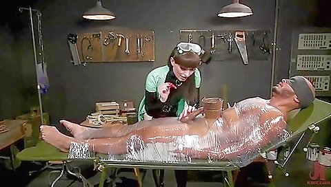 Busty milf and sexy shemale in a latex body and a dildo